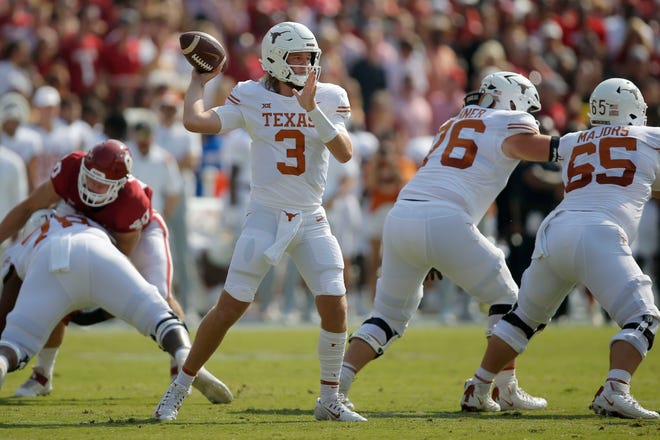 Texas Longhorns quarterback Quinn Ewers (3) throws a pass during the Red River Showdown college football game between the University of Oklahoma (OU) and Texas at the Cotton Bowl in Dallas, Saturday, Oct. 8, 2022. 
