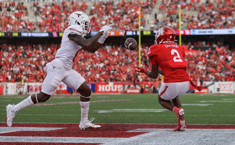 Oct 21, 2023; Houston, Texas, USA; Houston Cougars wide receiver Matthew Golden (2) makes a catch for a touchdown during the third quarter as Texas Longhorns defensive back Terrance Brooks (8) defends at TDECU Stadium. Mandatory Credit: Troy Taormina-USA TODAY Sports