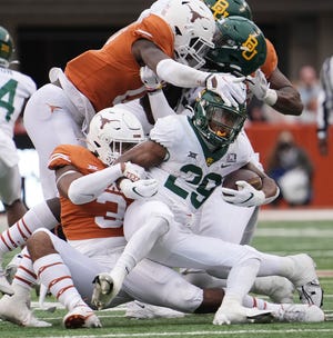 Baylor's Richard Reese, fighting for yardage against Texas last season, returns after rushing for almost 1,000 yards and earning freshman All-American honors.