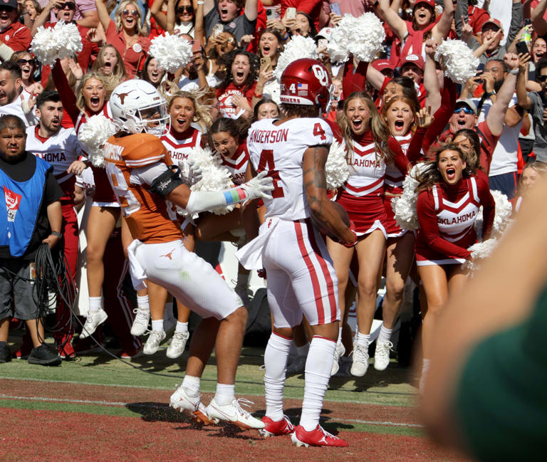 Oklahoma Sooners wide receiver Nic Anderson (4) celebrates a touchdown beside Texas Longhorns defensive back Jerrin Thompson (28) late in the fourth quarter during the Red River Rivalry college football game between the University of Oklahoma Sooners (OU) and the University of Texas (UT) Longhorns at the Cotton Bowl in Dallas, Saturday, Oct. 7, 2023. Oklahoma won 34-30. Bryan Terry, The Oklahoman