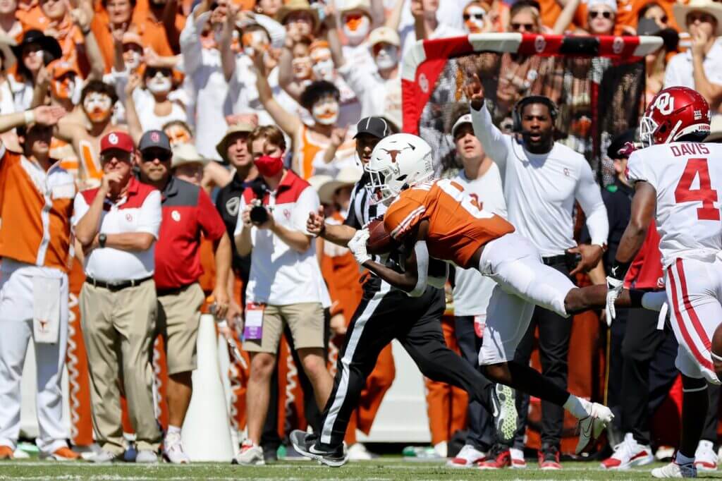 Oct 9, 2021; Dallas, Texas, USA; Texas Longhorns wide receiver Xavier Worthy (8) makes a catch against the Oklahoma Sooners during the second quarter at the Cotton Bowl. Mandatory Credit: Kevin Jairaj-USA TODAY Sports